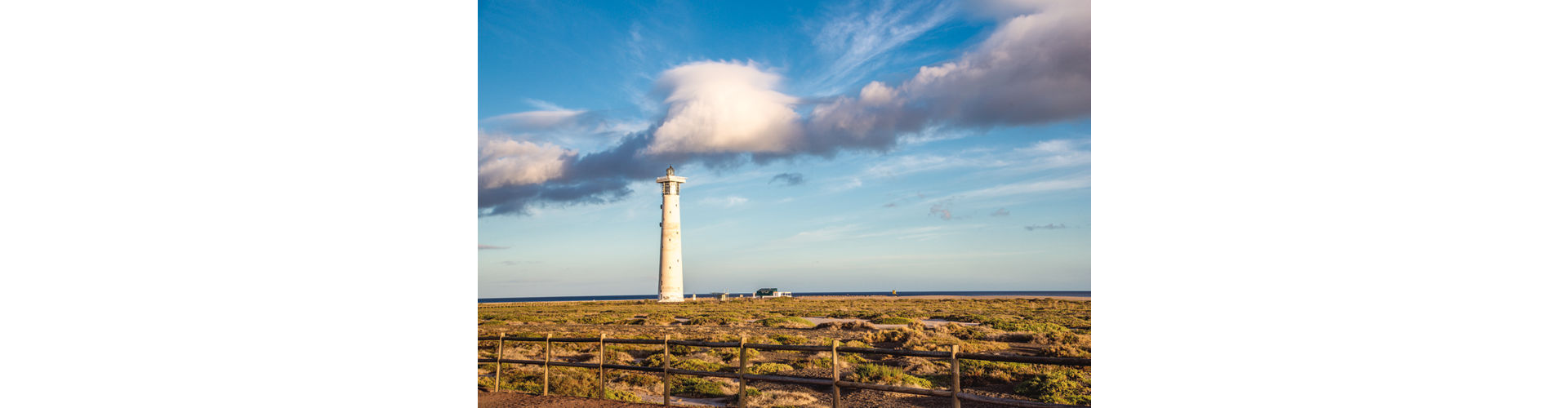Iconic lighthouse at Faro de Morro Jable, overlooking the coastline of Fuerteventura.
