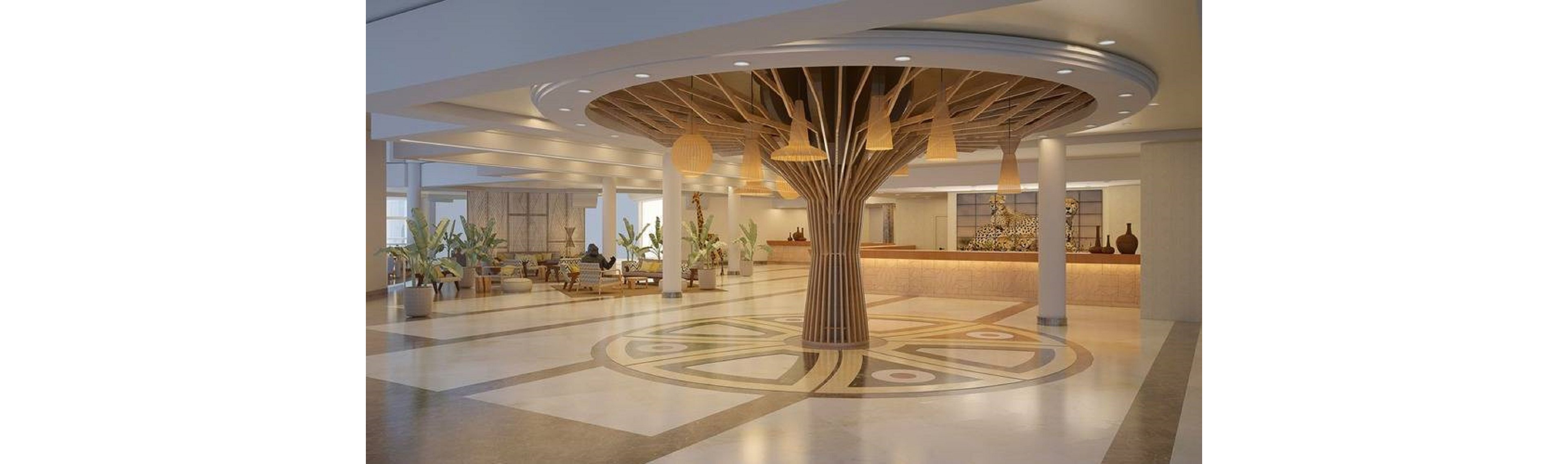 A large contemporary hotel lobby features a dramatic central column shaped like a stylized tree with radiating wooden beams. The space is open and airy, with polished floors, white pillars, and warm wood accents. Pendant lights hang from the ceiling, and seating areas with plants and modern furniture are arranged around the lobby. In the background, a long reception desk and decorative wall elements add to the sophisticated, resort-like atmosphere.
