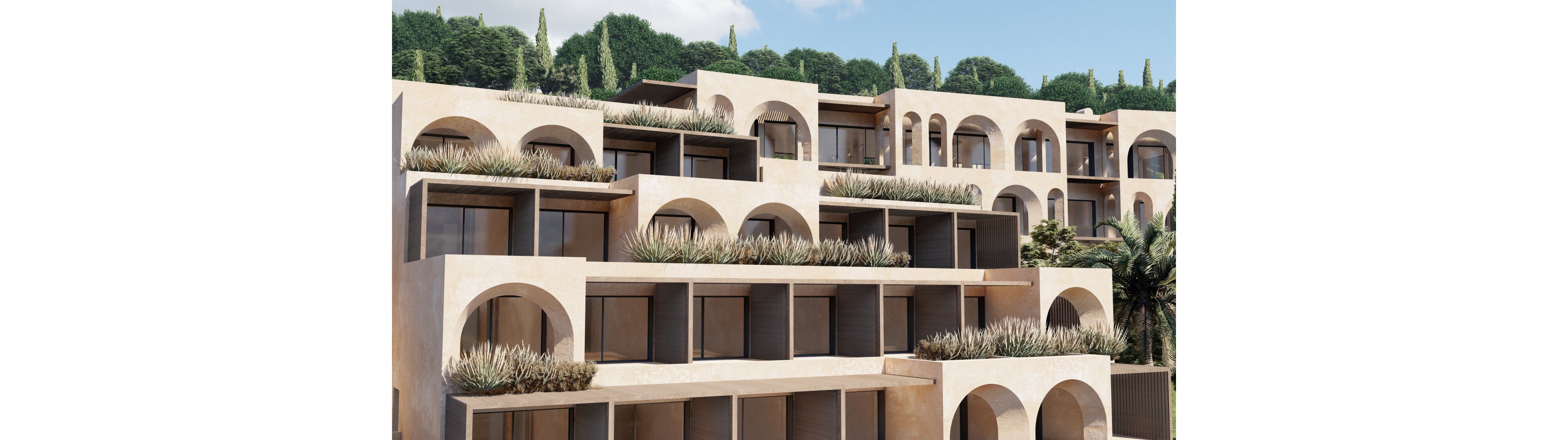 A contemporary multi-level building features a series of stacked terraces and prominent archways. Large windows and recessed balconies create a geometric, stepped facade. Desert-toned walls contrast with linear planters filled with grasses and succulents. Lush green trees and vegetation rise behind the structure, suggesting a hillside or resort setting under a bright sky.