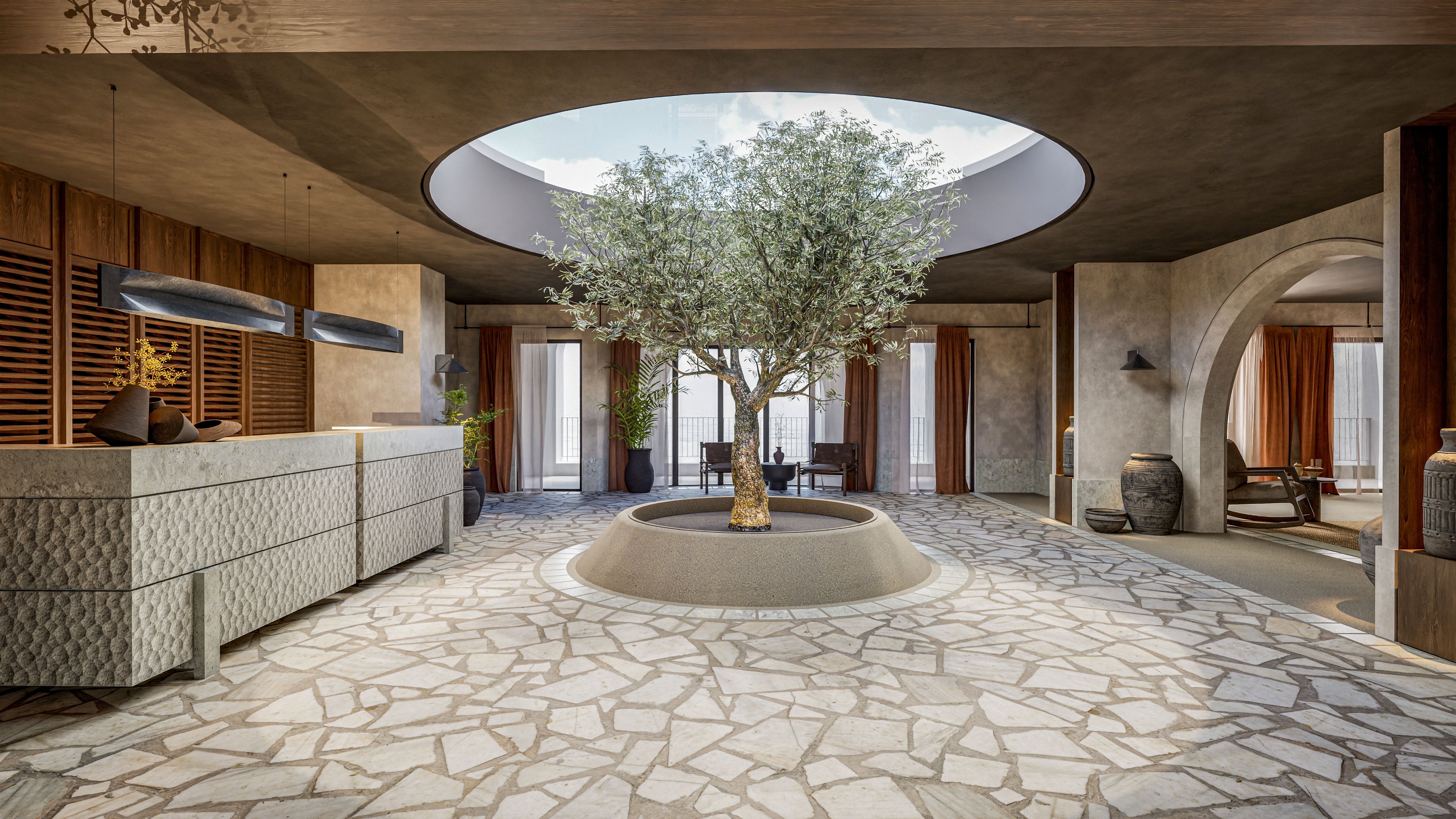 A contemporary hotel lobby features a large tree planted in a circular planter beneath an open skylight. Natural light floods the space, highlighting stone flooring and textured reception desks on the left. Wooden slatted panels and floor-to-ceiling curtains frame the background, creating a warm and inviting atmosphere. Neutral tones, organic materials, and minimalist furnishings emphasize a calm, luxurious design.