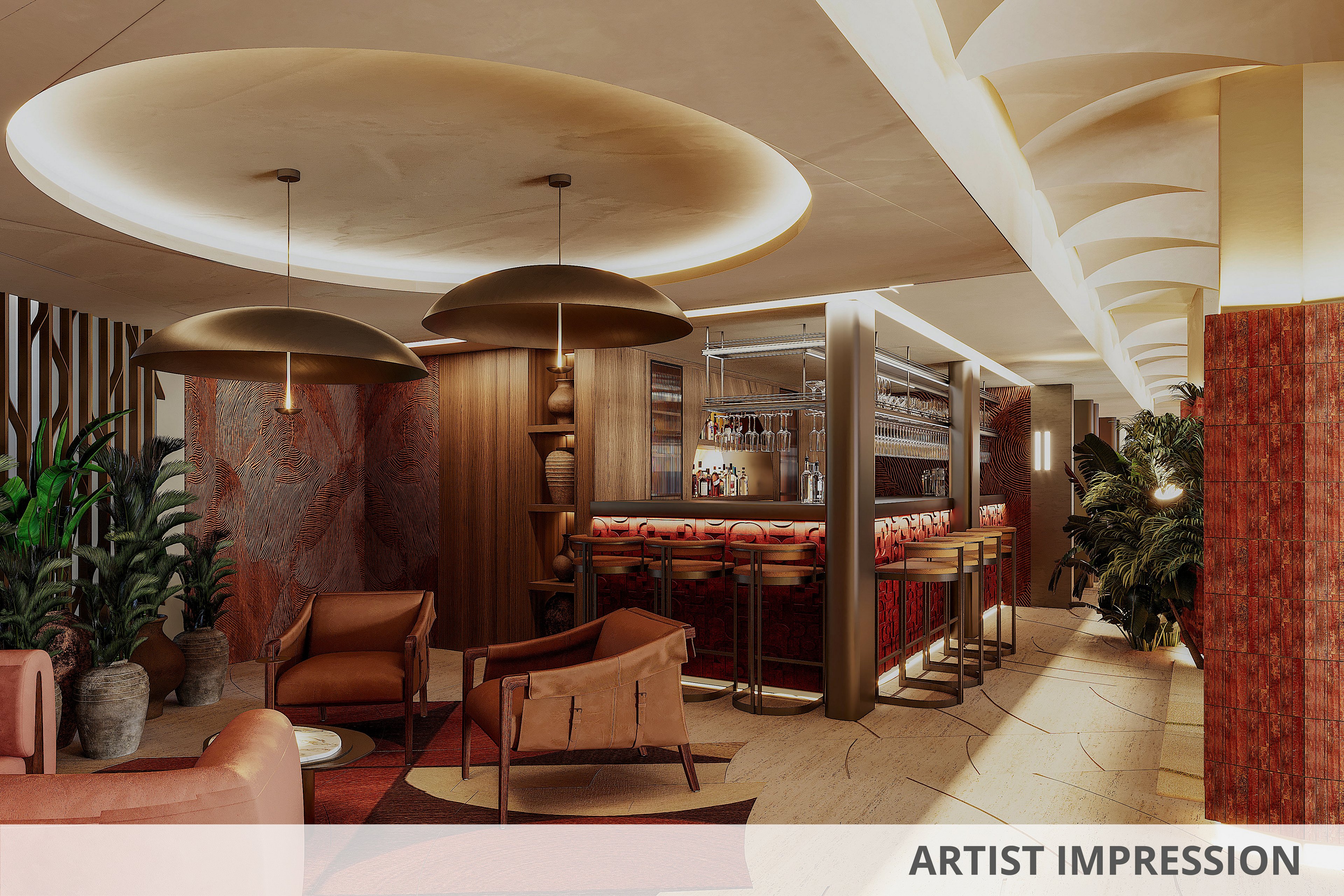 A stylish contemporary bar lounge features plush armchairs and a sleek counter with bar stools. Warm ambient lighting from large circular ceiling fixtures and pendant lamps creates a cozy atmosphere. The space is accented with red and beige tones, textured wall panels, and decorative columns. Lush indoor plants soften the modern design and add a natural touch to the interior.