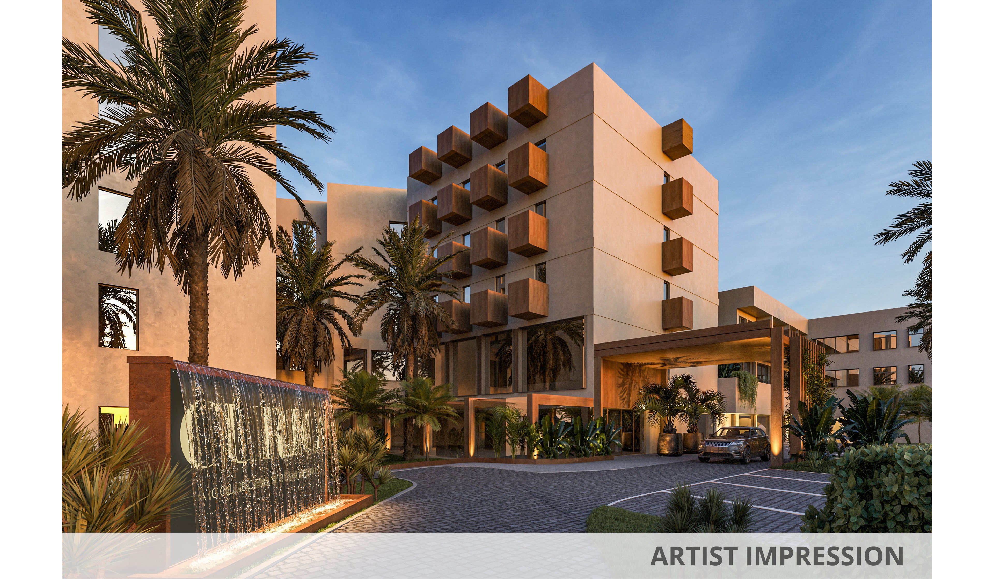 A contemporary multi-story resort building is shown at dusk with warm architectural lighting and geometric balconies. The entrance features a covered driveway where a car is parked, surrounded by lush tropical landscaping and tall palm trees. A large illuminated water feature with engraved text stands near the curved cobblestone drive, adding a luxurious touch. The sky is softly lit, enhancing the warm tones of the building and the inviting atmosphere of the scene.