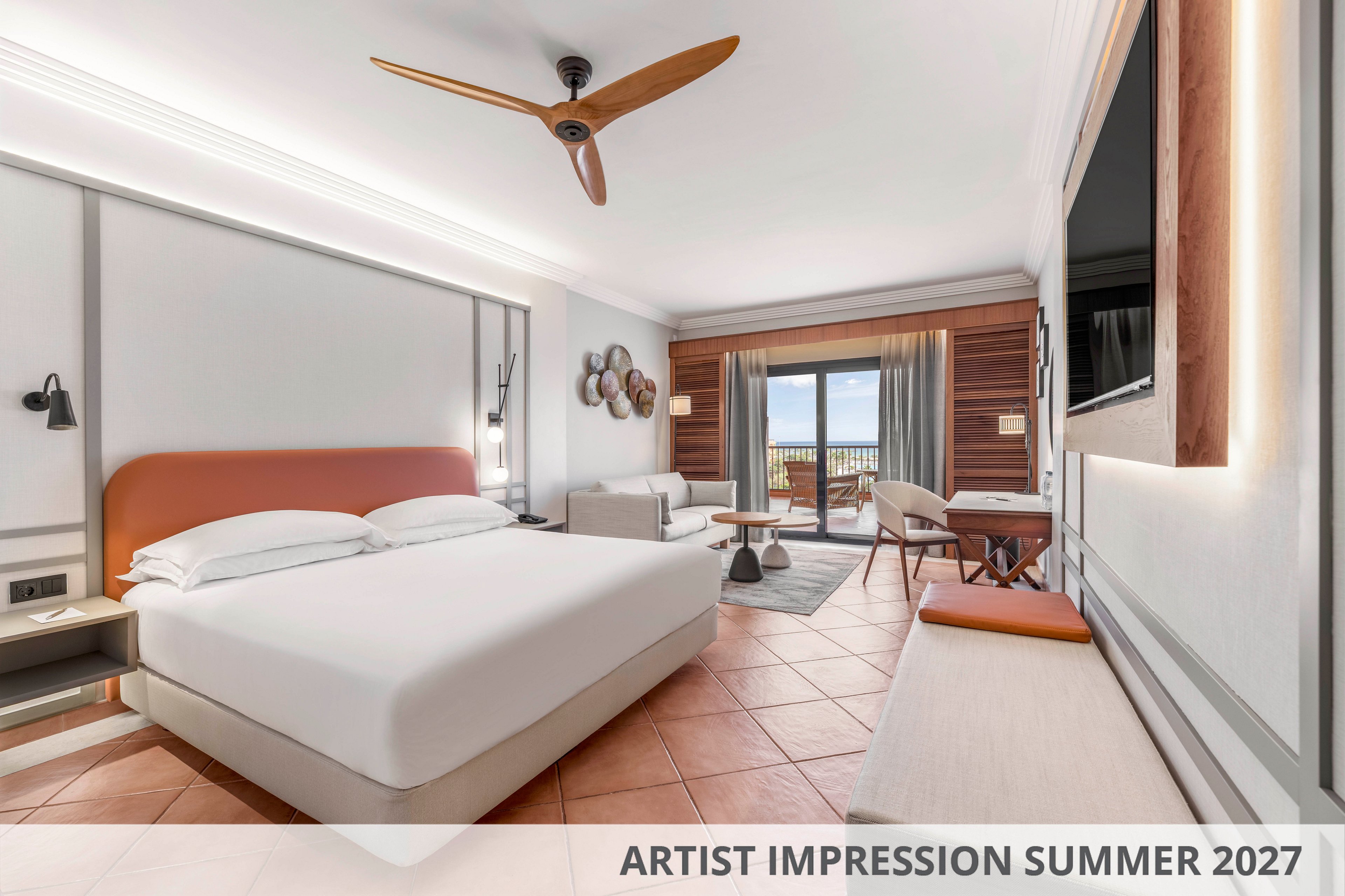 Spacious contemporary hotel room with a large bed and minimalist furnishings. The setting features warm tiled flooring, wooden accent wall, and a ceiling fan, opening to a balcony with outdoor seating and a scenic view. Neutral tones with soft orange and beige create a calm, inviting atmosphere. Text on the image reads "ARTIST IMPRESSION SUMMER 2027," indicating a future seasonal concept.