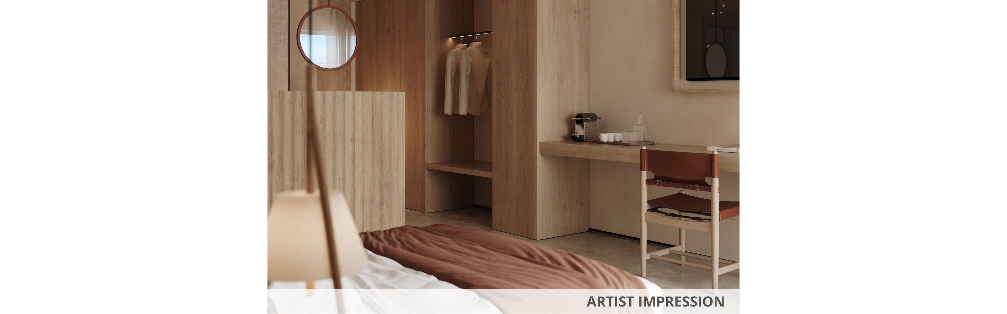 Warm, minimalist hotel bedroom interior rendered as an artist impression. The scene shows an open wooden wardrobe with hanging clothes and a simple desk with a coffee machine and cups. A leather and wood chair sits by the desk, while soft bedding in neutral tones is visible in the foreground. The overall palette is beige and brown, creating a calm and contemporary atmosphere. The text "ARTIST IMPRESSION" appears at the bottom of the image.