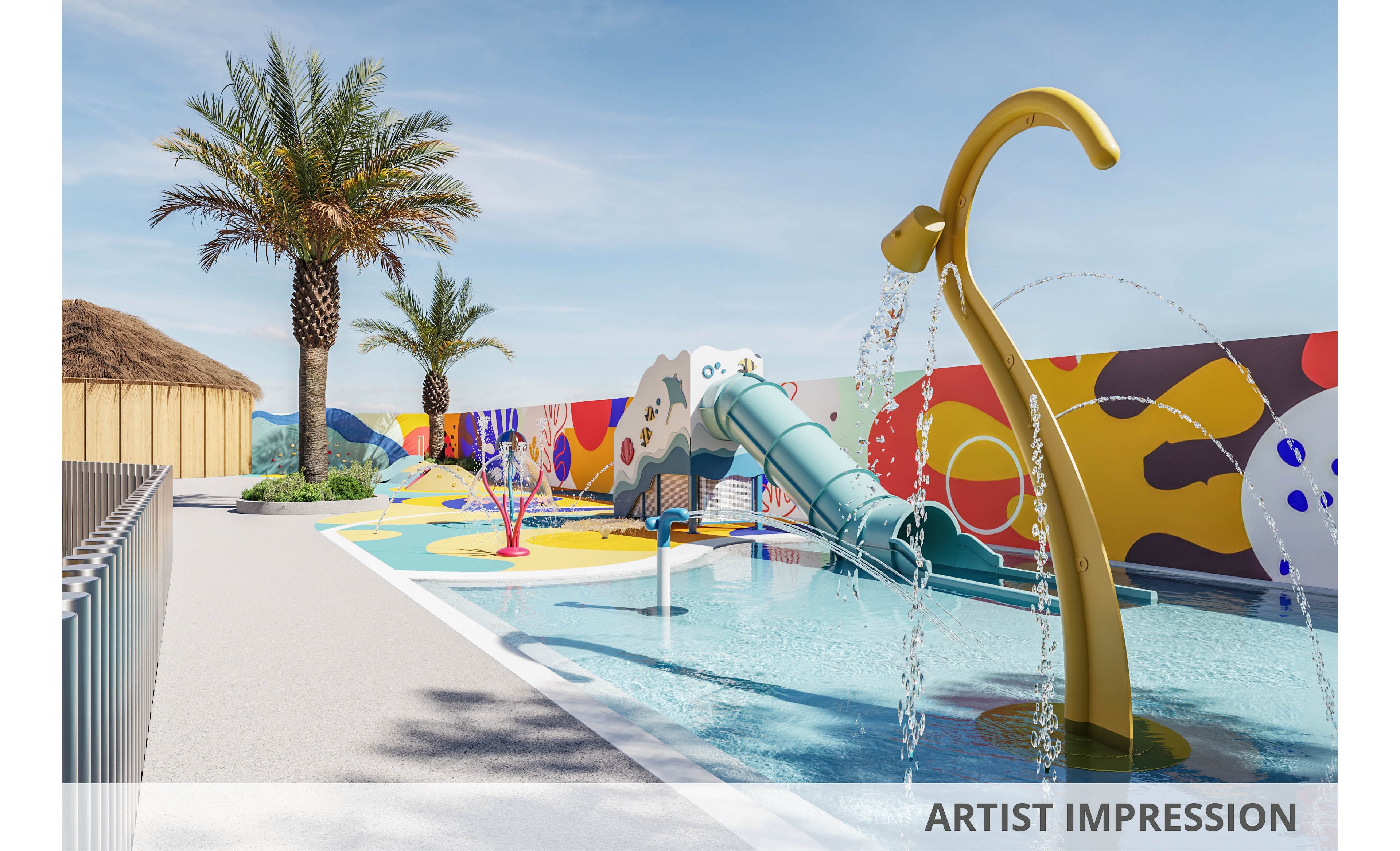An outdoor children’s splash park features a shallow pool with interactive water fountains and a curved slide. Brightly painted ground patterns and a colorful mural wall create a playful, modern atmosphere. Palm trees and a thatched-roof structure suggest a warm, resort-like setting. Clear blue sky and strong sunlight emphasize a fun, summery mood.