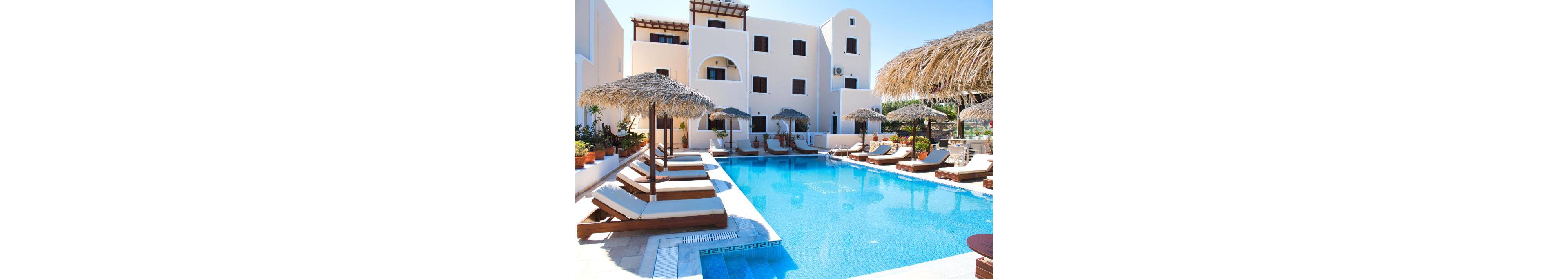 A serene outdoor pool area at a luxury resort featuring multiple sun loungers and straw parasols. The setting includes white Mediterranean-style architecture with arched windows and balconies. The crystal-clear blue water of the pool reflects the sunny atmosphere, creating a relaxing vacation vibe.