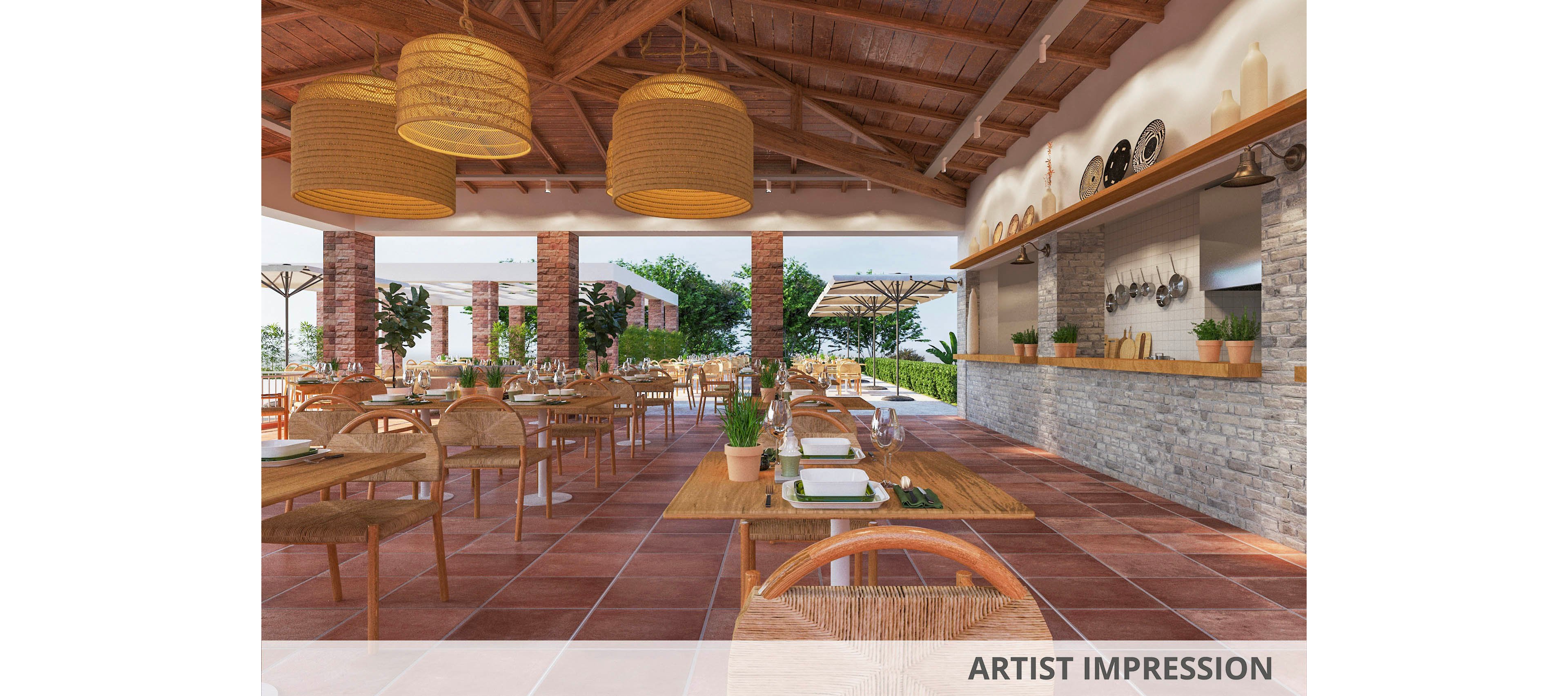 A spacious open-air restaurant features wooden tables and chairs arranged neatly under a high, exposed wooden beam ceiling. The setting includes terracotta tile flooring, stone accents, and hanging wicker light fixtures, creating a warm and inviting atmosphere. Potted plants and table settings add a touch of greenery and elegance. The restaurant opens to an outdoor area with umbrellas and lush landscaping visible in the background. No visible text or numbers are present in the image.