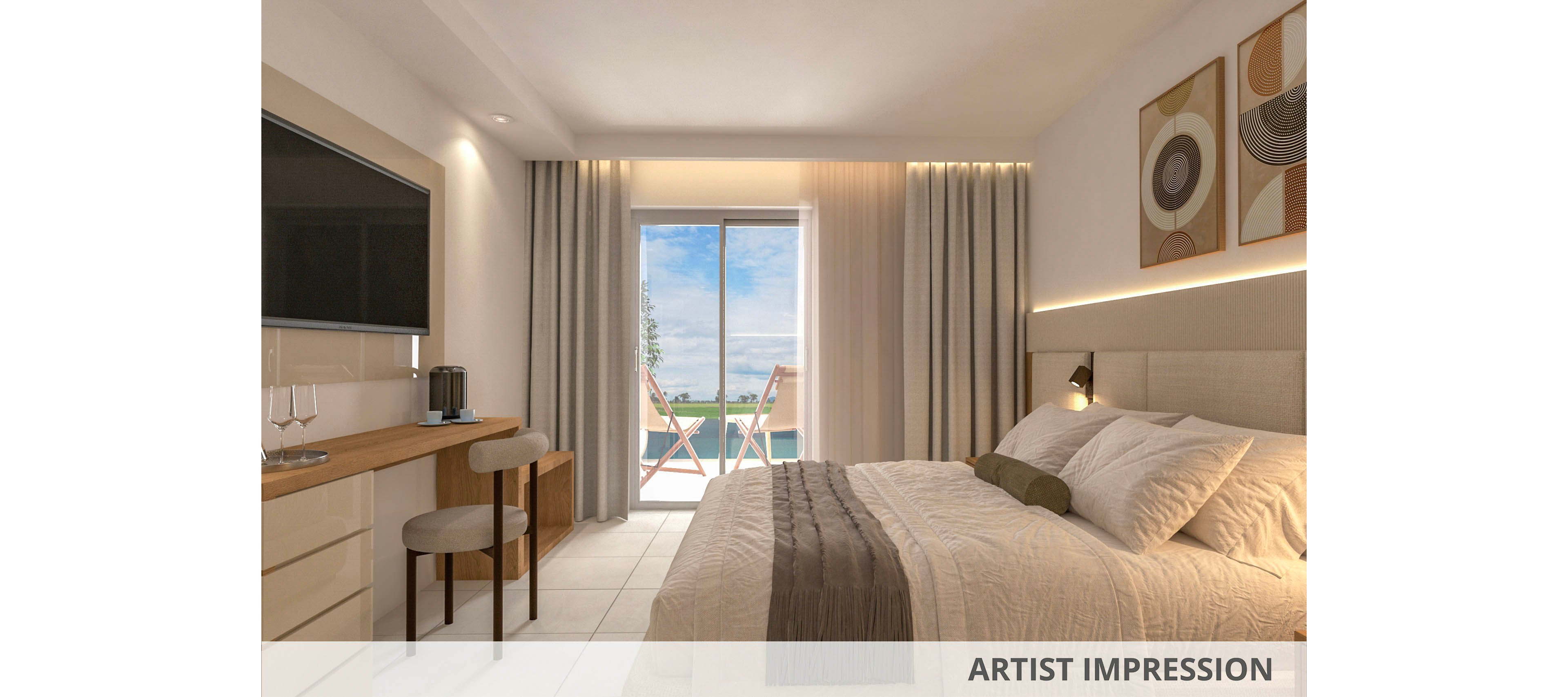 A contemporary hotel room features a neatly made bed with neutral bedding, a wall-mounted television, and a wooden desk with two chairs. Large glass doors open to a balcony with two chairs, offering a scenic view of the ocean and blue sky. The room is decorated in soft beige tones with abstract wall art, creating a calm and inviting atmosphere.