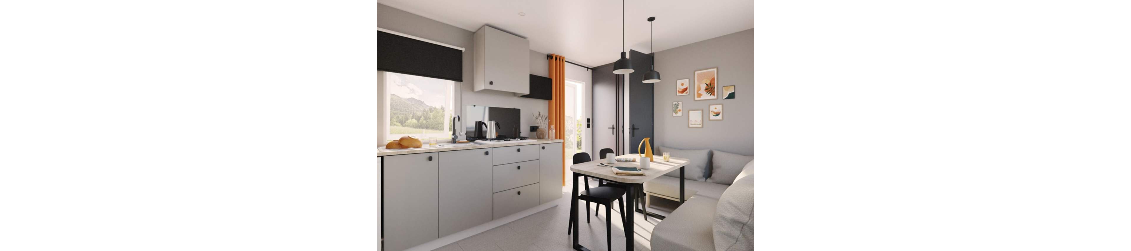 Contemporary compact kitchen interior with light gray cabinets and integrated appliances. A small dining table with black chairs sits beside a beige sofa, creating an open-plan living and eating space. Large windows and a glass door bring in natural light, complemented by black blinds and an orange curtain. Wall art, pendant lights, and neatly arranged tableware add warmth and a lived-in feel to the modern room.