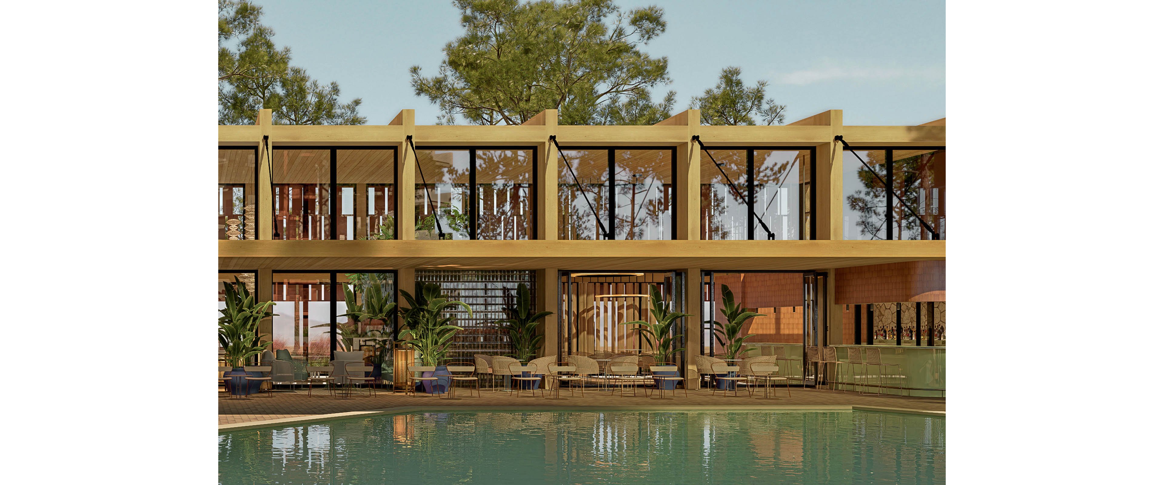 A contemporary two-story building with large glass windows faces a calm swimming pool. The structure features warm wooden and earthy tones, with vertical beams and open terraces. Lounge chairs and seating areas line the poolside, complemented by potted tropical plants. Tall trees rise behind the building, creating a relaxed, natural resort atmosphere under a clear sky.