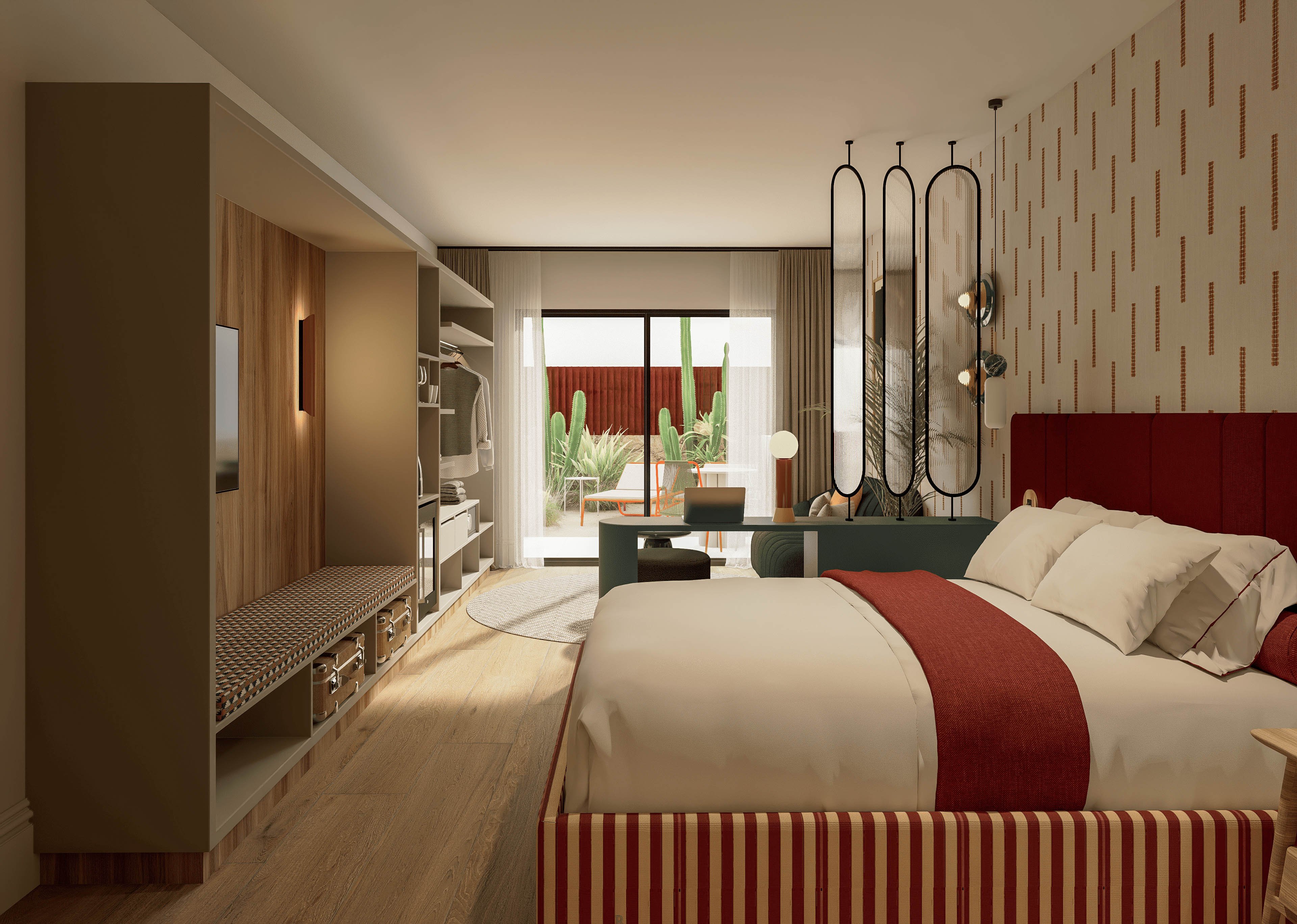 Contemporary hotel room interior featuring a large bed with red upholstered headboard and striped base. The space includes built-in shelving, a wall-mounted television, and a bench along the left side. Warm wood flooring and beige walls are accented by red decorative elements and patterned wallpaper. Large sliding glass doors open to an outdoor terrace with plants and seating, allowing natural light to fill the room.