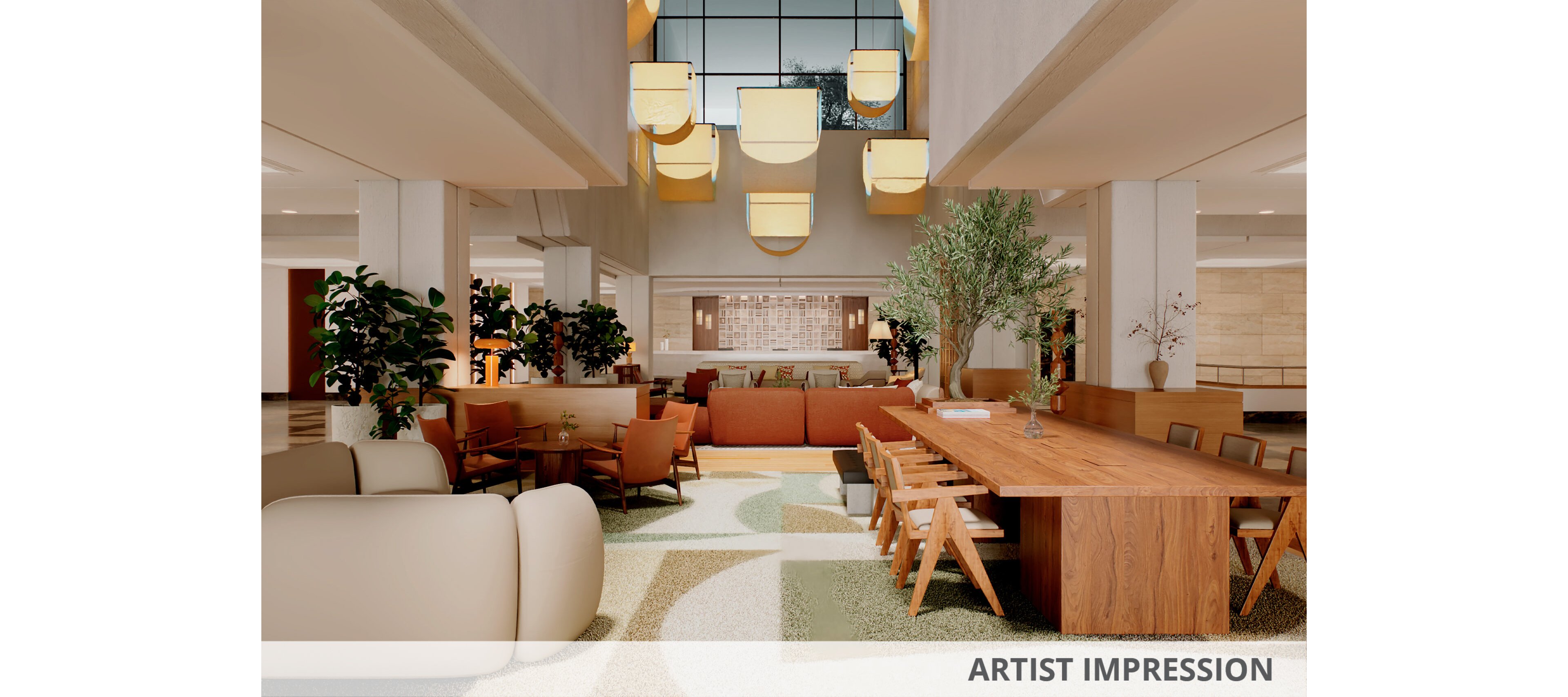 Spacious contemporary lobby interior featuring a long wooden communal table and surrounding lounge seating. The setting includes soft upholstered sofas, armchairs, and bar-style chairs arranged for socializing and work. Warm pendant lights hang from the high ceiling, illuminating plants and a large wall artwork in the background. Neutral tones with earthy accents and geometric carpet patterns create a welcoming, modern atmosphere.