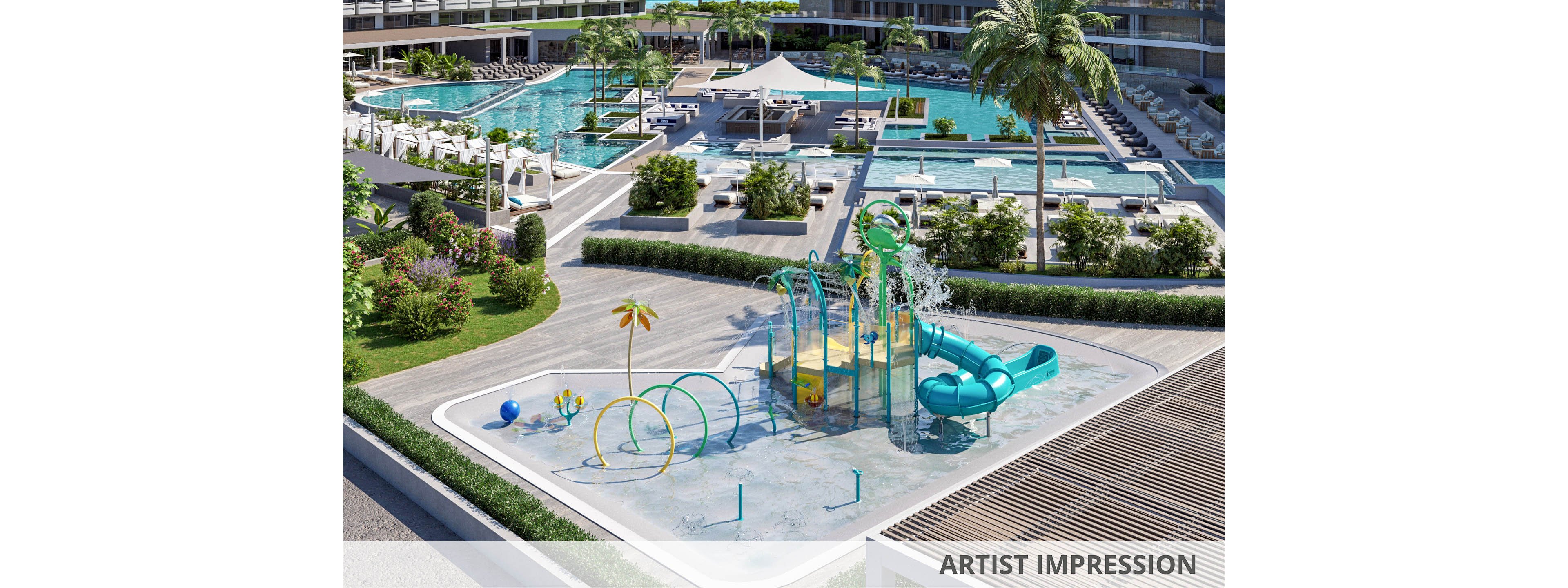 A contemporary resort pool complex features multiple large swimming pools surrounded by lounge chairs and landscaped greenery. In the foreground, a colorful children’s splash park includes water sprays, hoops, and a twisting slide on a shallow wet play surface. Palm trees, cabanas, and shaded seating areas create a relaxing vacation atmosphere around the pools. The scene is bright and sunny, emphasizing leisure, family fun, and outdoor recreation.