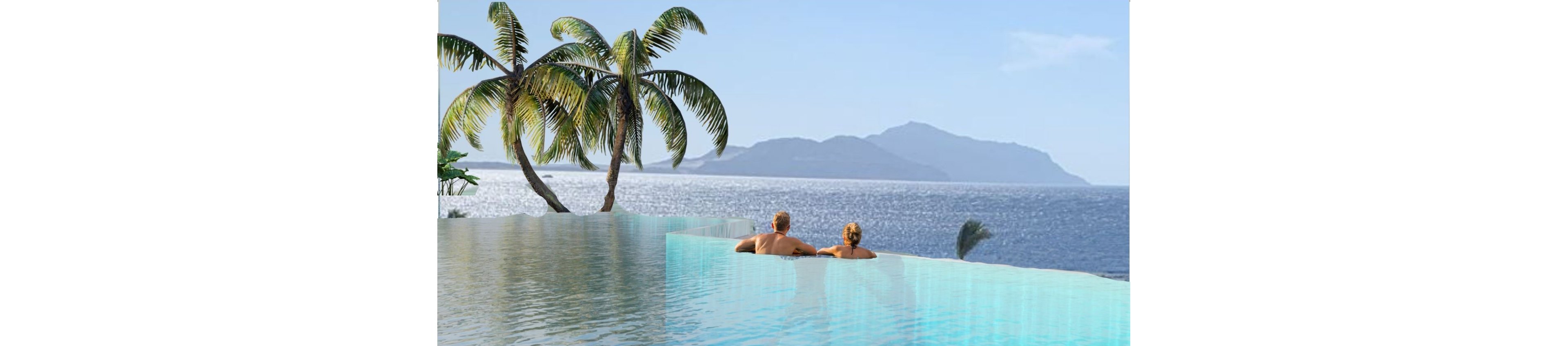 A couple is seen from behind relaxing in an infinity pool overlooking a calm ocean. Palm trees frame the left side of the scene, adding to the tropical atmosphere. Distant islands rise from the horizon under a clear blue sky. The water in the pool reflects the sky, creating a serene and luxurious vacation setting.