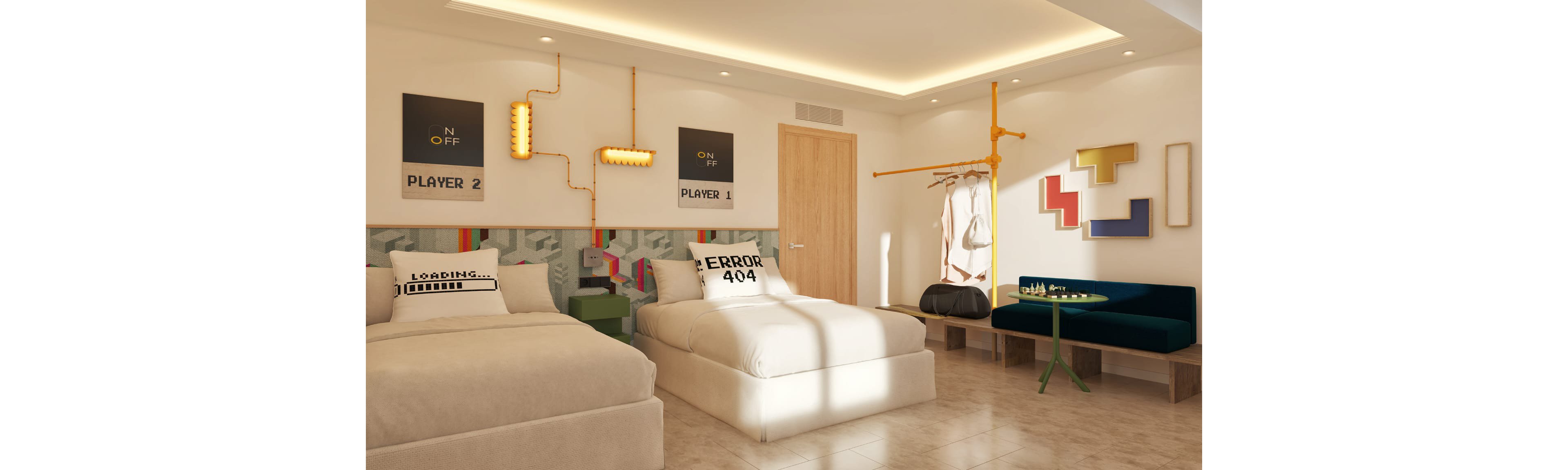 Contemporary hotel room featuring two twin beds with quirky gaming-themed pillows reading "LOADING" and "ERROR 404". The space has light-colored walls, a wooden door, and tiled flooring, with warm recessed ceiling lighting. Decorative wall art, exposed pipe-style lighting, and a minimalist open wardrobe add a playful, industrial touch. A small round table with chairs and a cushioned bench completes the cozy seating area.