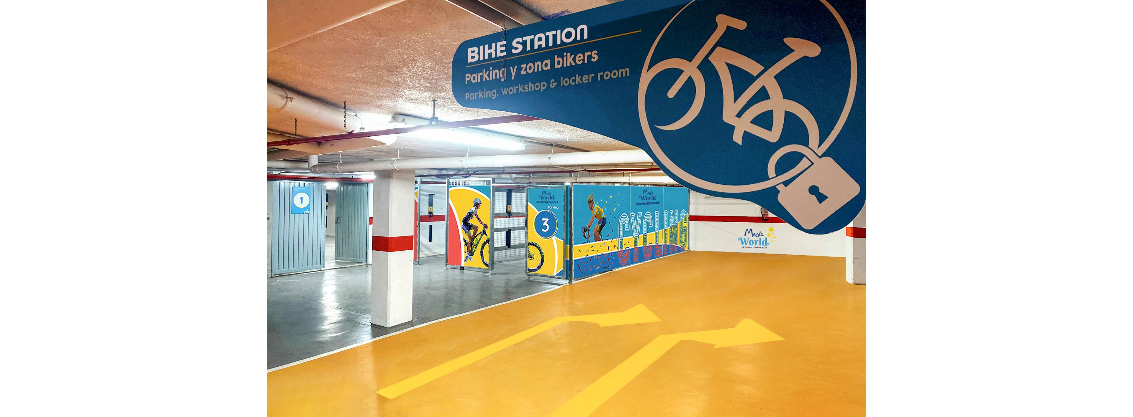 Indoor bike station with designated parking zones is shown in a brightly painted garage. A large blue sign reads BIKE STATION with information in Spanish about parking, workshop, and locker room. Numbered sections 1, 2, and 3 are visible, each marked with cycling graphics and bold colors. Yellow directional arrows on the floor guide cyclists through the space, creating a modern and organized environment.