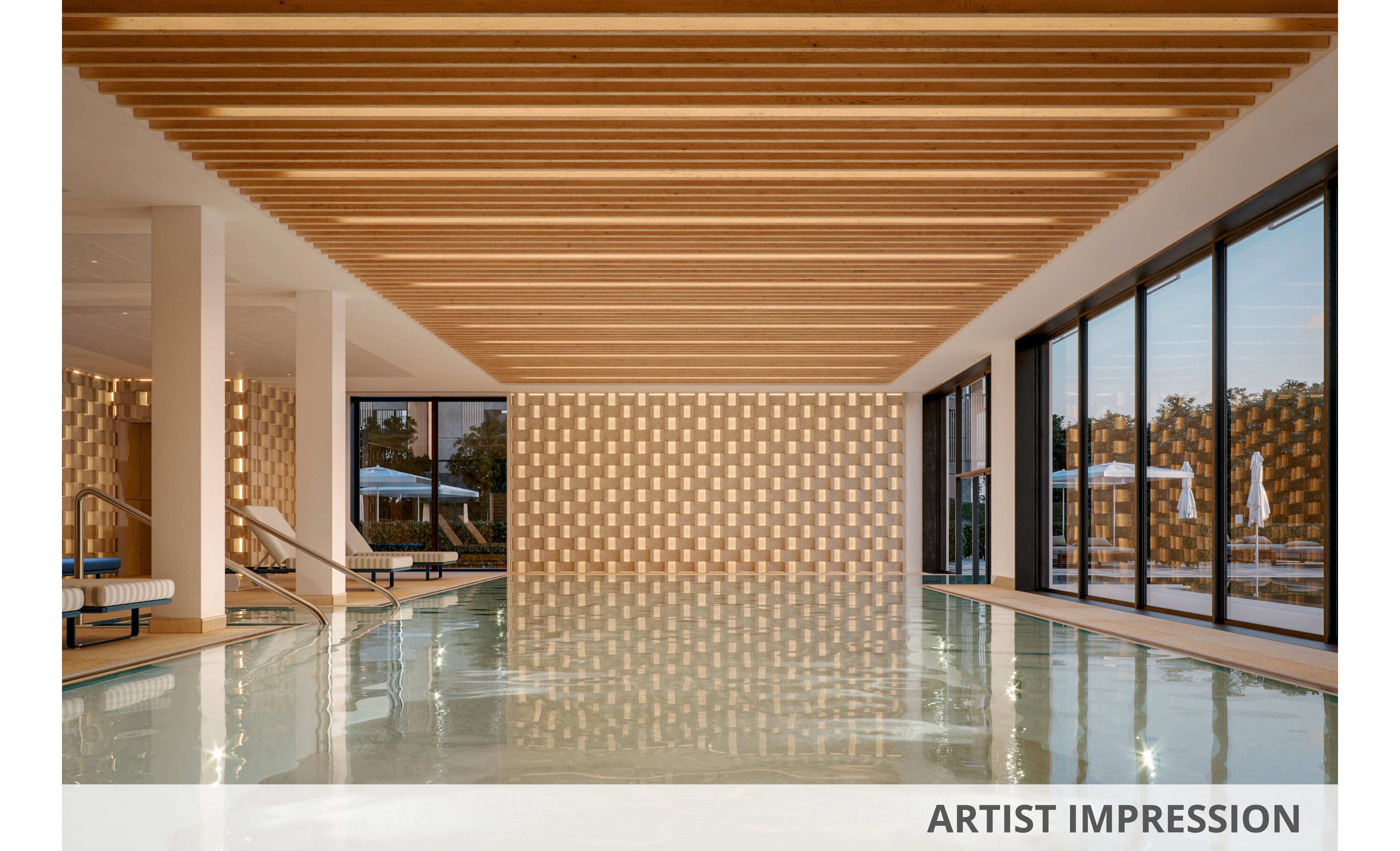 A contemporary indoor swimming pool is featured, highlighted by a geometric wooden slat ceiling and patterned wall tiles. Large floor-to-ceiling windows allow natural light to fill the space and offer views of an outdoor area with umbrellas. The tranquil setting is enhanced by clean architectural lines and a neutral color palette. No people or visible text are present in the image.