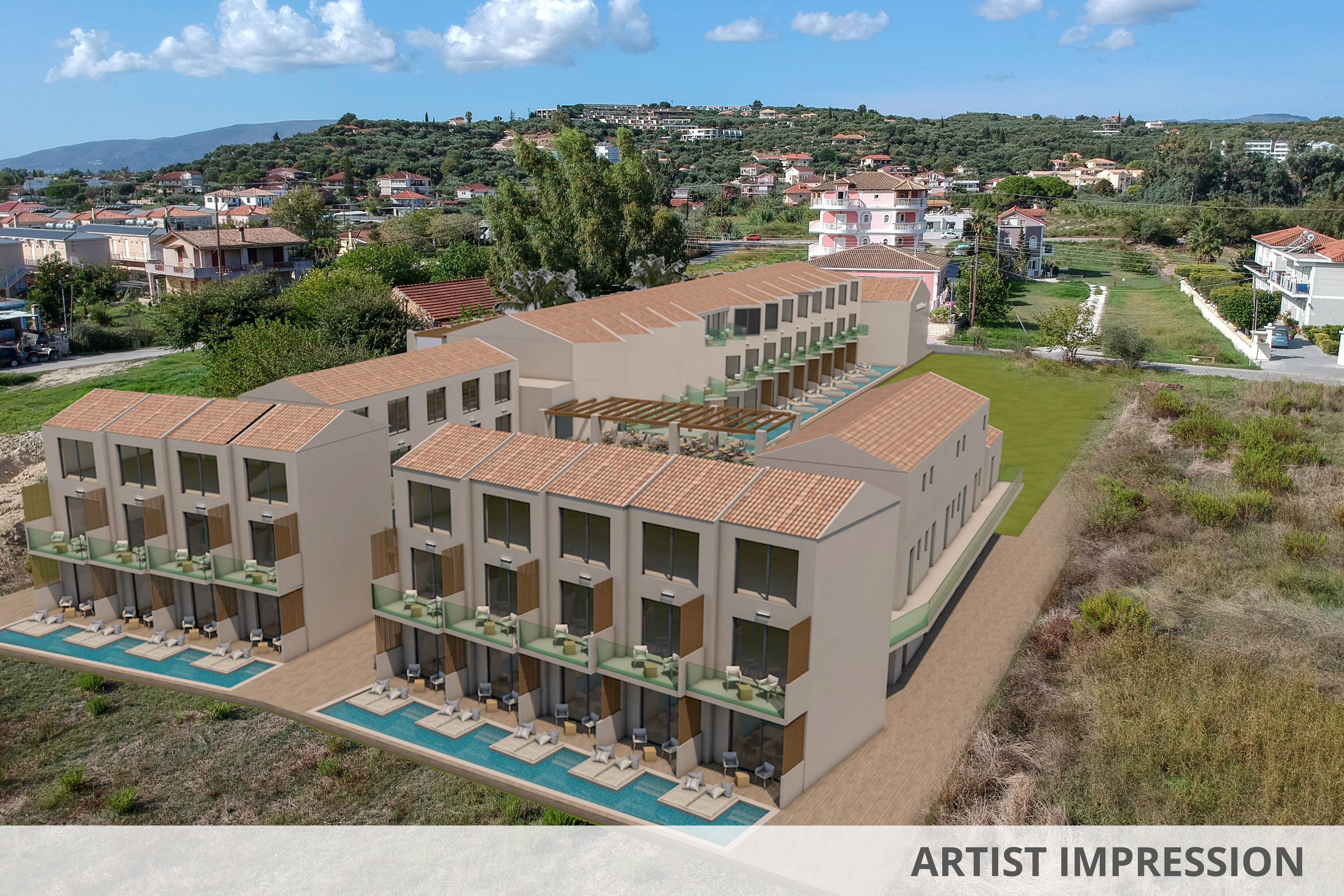 A newly constructed apartment complex features multiple units with private balconies and ground-floor pools. The buildings are set in a semi-rural area with open fields and neighboring residential homes visible in the background. The architecture is modern with clean lines and neutral tones, and the setting is bright and sunny with a clear blue sky. No visible text or numbers are present in the image.